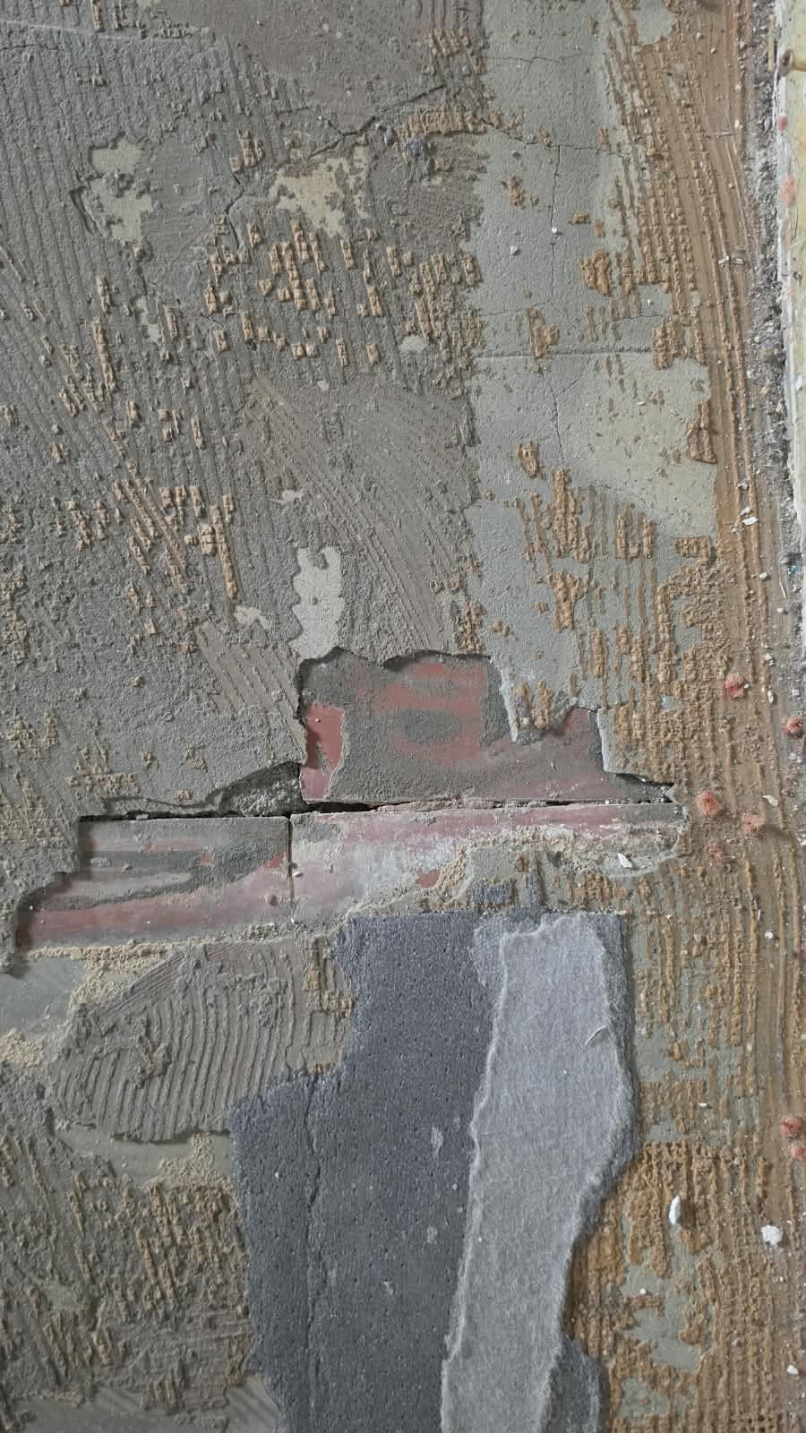 Layers of paint flaking off an original wall at SoHome Lausanne