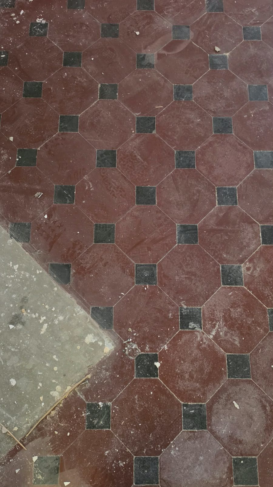 Original octagonal red and black floor tiles at SoHome Lausanne