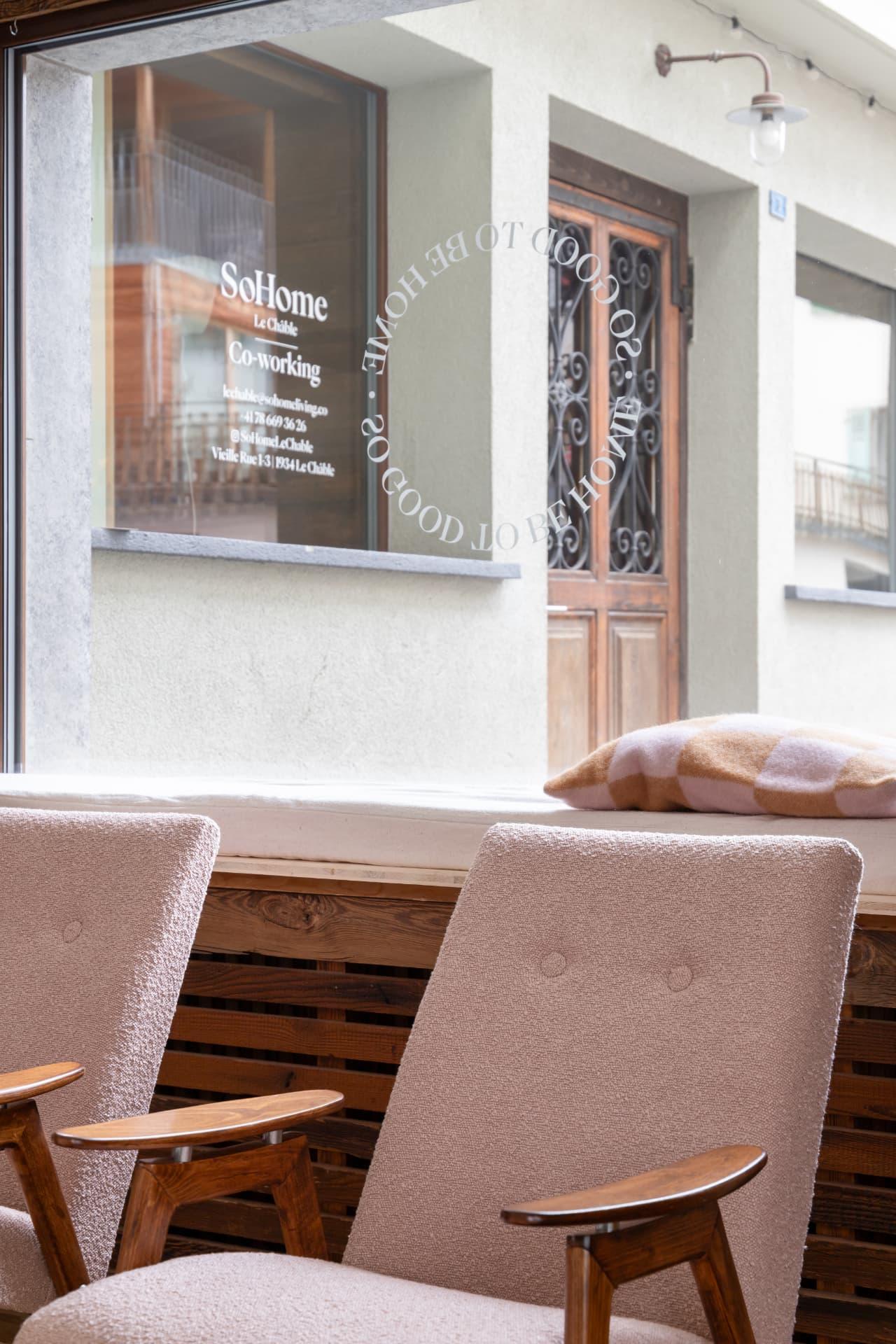 The window bench with SoHome Le Châble on the glass
