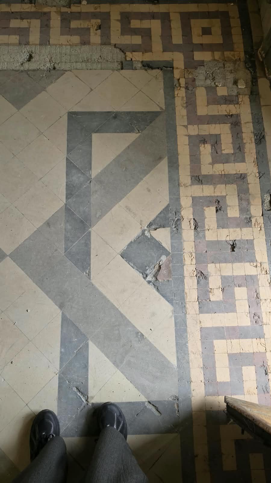 A close-up of the original mosaic floor tiles at SoHome Lausanne