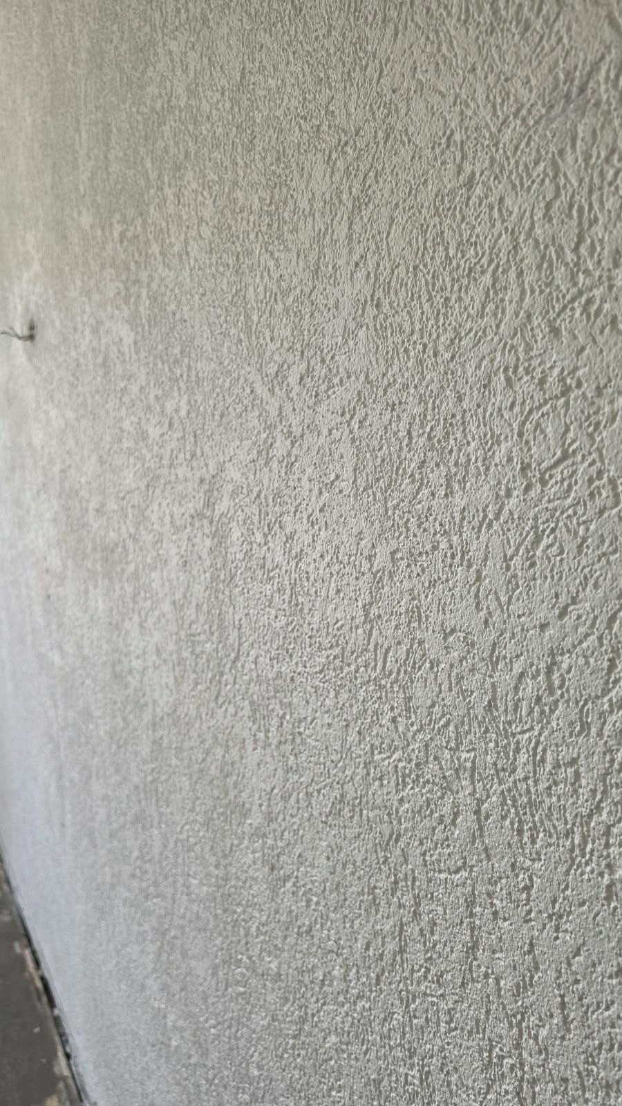Texture of the rough rendered wall at SoHome Lausanne