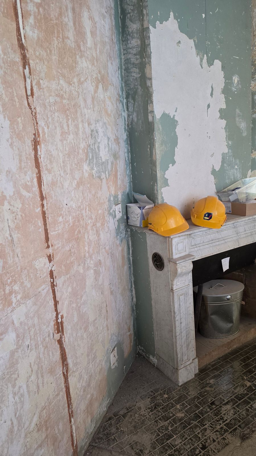 An original marble fireplace uncovered during the Lausanne renovation