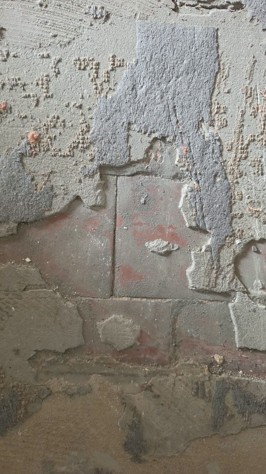 Original red floor tiles exposed during renovation at SoHome Lausanne