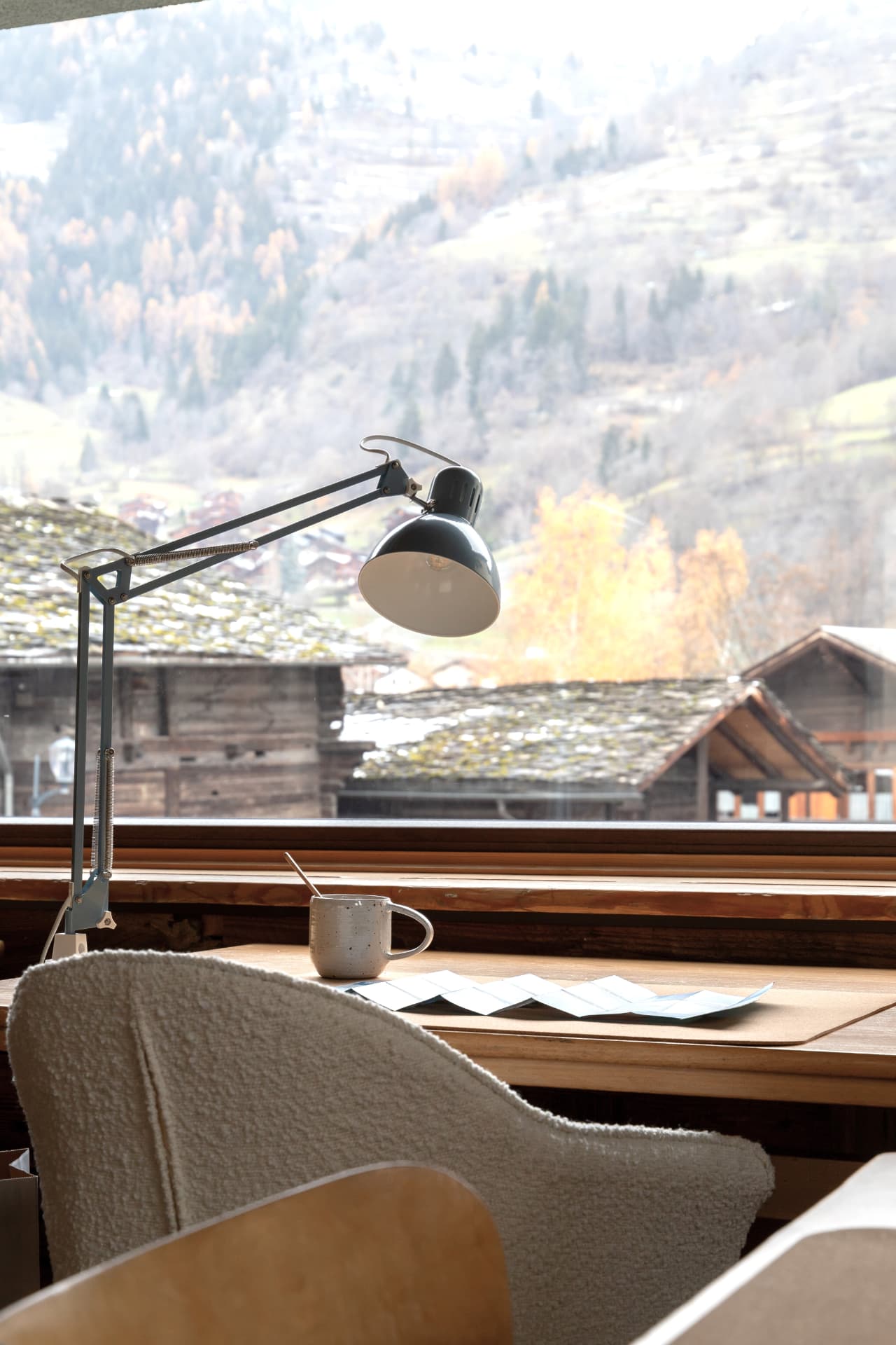 A desk overlooking the village at SoHome Le Châble